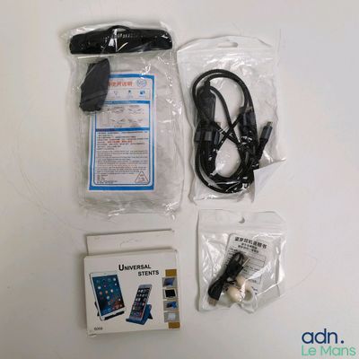 the contents of a cell phone are laid out on the table