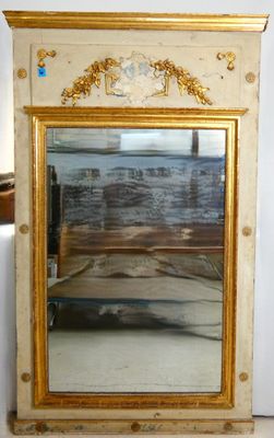 a mirror that is sitting on a table in a room