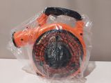 a plastic bag with an orange and black object inside of it