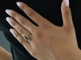 a woman with a ring on her finger and a ring on her hand