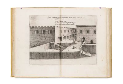 an open book with a drawing of a castle on it