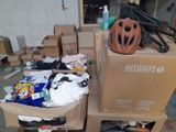 a pile of boxes and a bicycle helmet on a carton