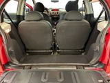 two seats in the back of a red car