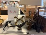 a lot of antiques on the table in the store