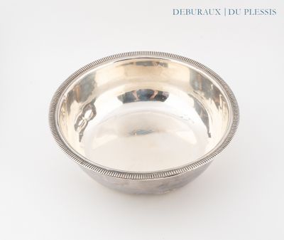 a silver bowl on a white surface with a white background
