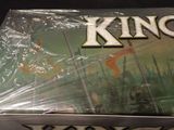 a box of king of the rings cards on a table