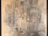 a picture of a painting of a cityscape in a black frame
