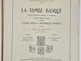 an old book that is open on a white surface