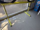 a bike that is sitting on a stand in front of a window