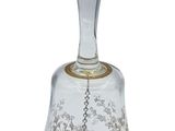 a close up of a glass bell on a white background