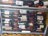 many bottles of wine in a case on a pallet
