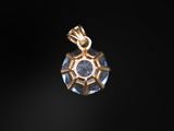 a gold pendant with a blue stone in the center