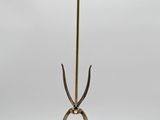 a brass table lamp with a glass shade on top of it