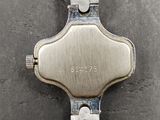 a close up of a wrist watch on a table