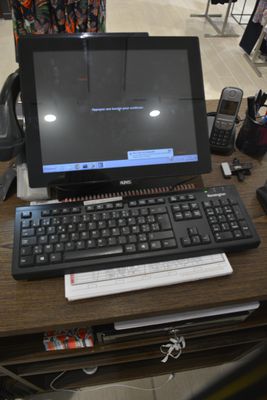 a laptop computer sitting on top of a wooden desk