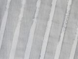 a close up of a rug with a stripe pattern on it