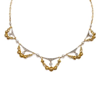 a gold and silver necklace with pearls on a white background
