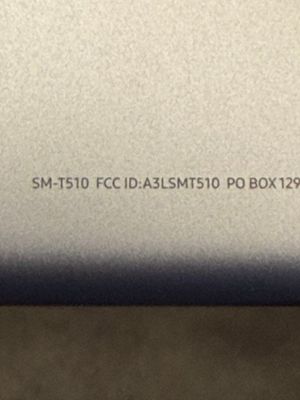 a close up of the back of a laptop computer with a keyboard on it