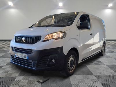 the white van is parked on a checkered floor in a room