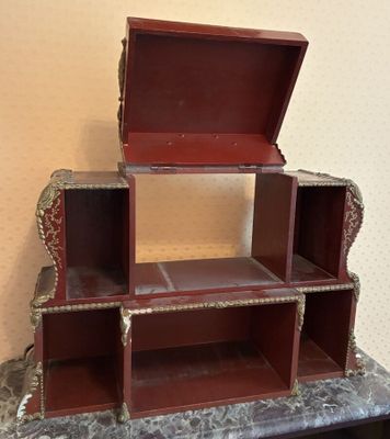 a small wooden box that is on top of a table