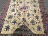 an oriental rug with a medallion design on a beige ground