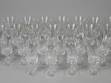 a lot of wine glasses that are sitting on a table