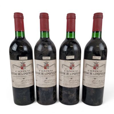 three bottles of red wine sitting next to each other on a white surface