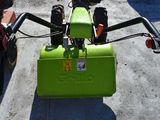 a green box sitting on the back of a motorcycle