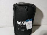 a black bag with a label on it sitting on a table