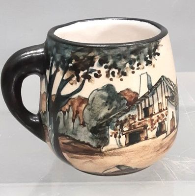 a coffee cup with a picture of a train on it