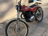 a motorcycle that is parked on the side of the street