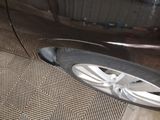 a close up of a car ' s tire on the floor