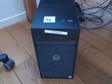 a dell computer on the floor with a mouse on the floor