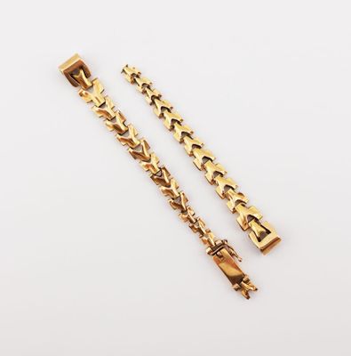 a pair of gold plated bracelets