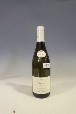 a bottle of wine that is sitting on a table