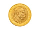 l'image d'une pièce d'or sur laquelle figure le visage d'un homme