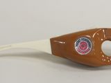 a bottle opener with a handle on a white table