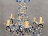 an image of a chandelier with blue and clear glass beads