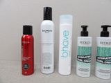 several different types of hair products are lined up on a counter