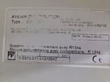 a label on the back of a white refrigerator