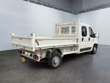 a white truck that is parked in a room