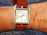 a close up of a person ' s wrist with a watch on it
