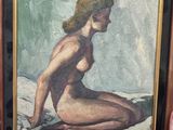 tableau représentant une femme nue assise sur un rocher, dans un cadre