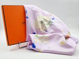 purple scarf with orange book and orange box on white background