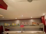 ceiling fan in a restaurant with books on the shelves