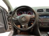 dashboard of a car with a steering wheel and various gauges