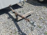 a trailer that is parked on the gravel ground