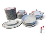 a lot of plates and bowls on the table