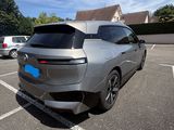 a silver car that is parked in a parking lot