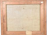 an old picture frame with a piece of wood in it